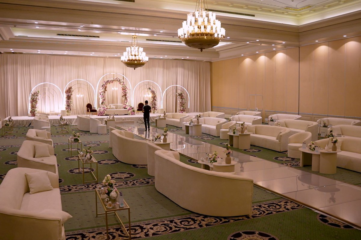 Banquet lounge seating under chandeliers before guests arrive