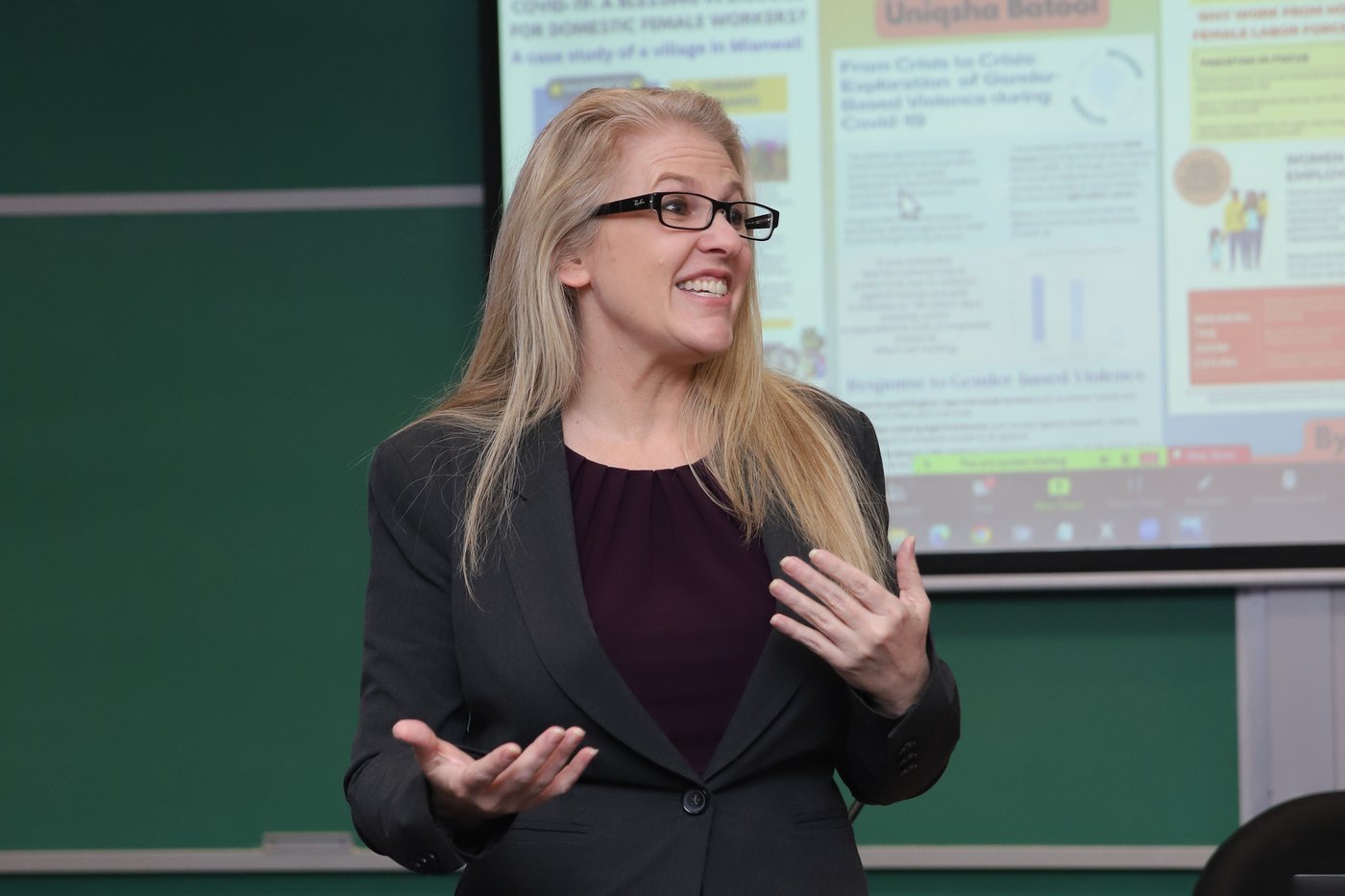 Speaker presenting a poster session at a corporate workshop