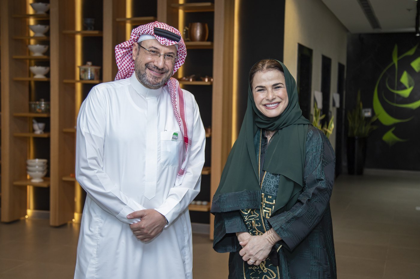 Couple photographed in a warm timber-panelled interior