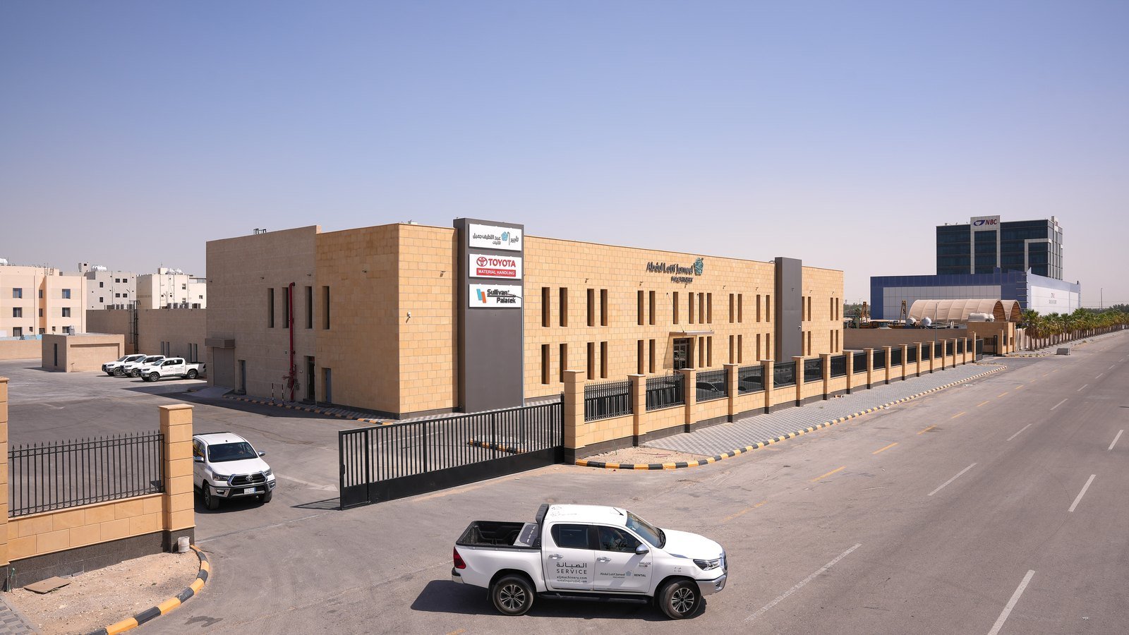 Industrial facility exterior along an access road